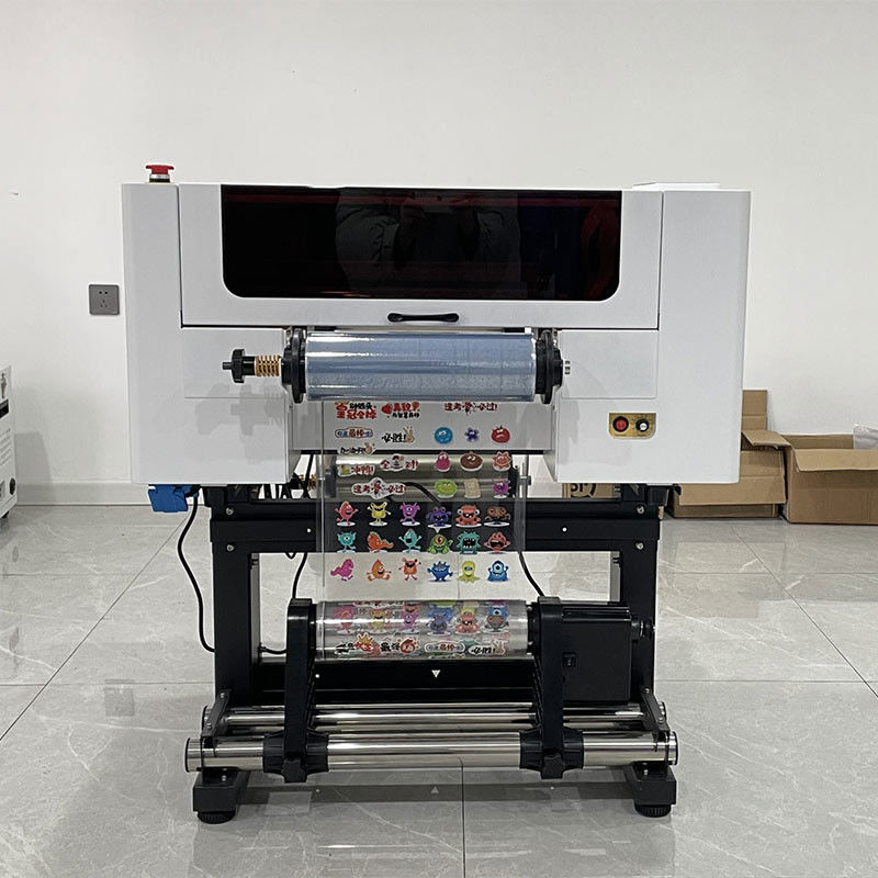 Imprimante DTF UV A3 30cm AB Film I3200 Têtes Tout en un rouleau à rouleau Imprimante DTF UV avec machine d'impression laminateur